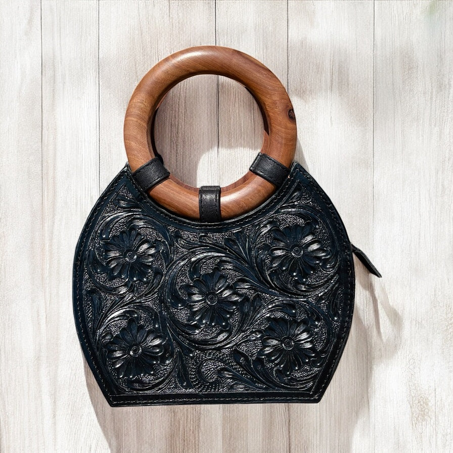 Black floral tooled leather handbag