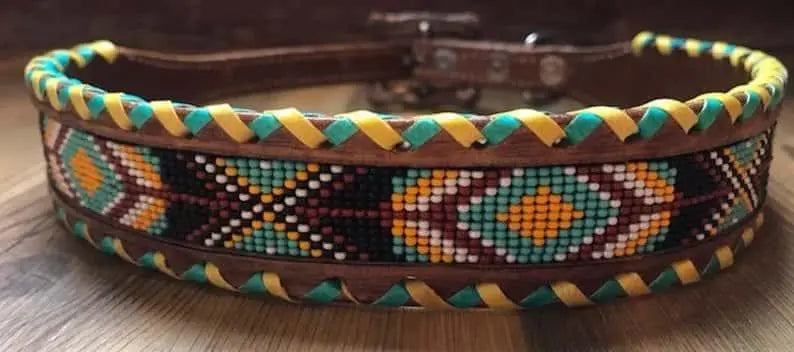 Genuine leather dog collar with teal, white, yellow and burgundy southwest beaded inlay design, a rawhide wrapped edge