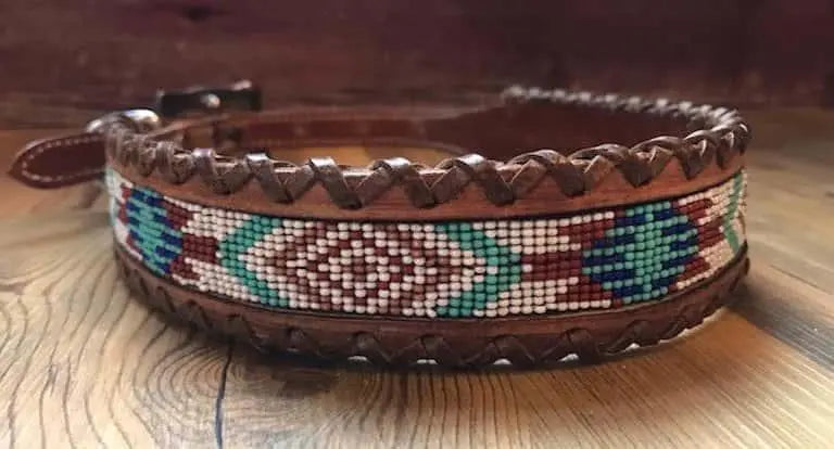 Genuine leather dog collar with white, teal, and burgundy southwest beaded inlay designa leather wrapped edge and copper hardware.