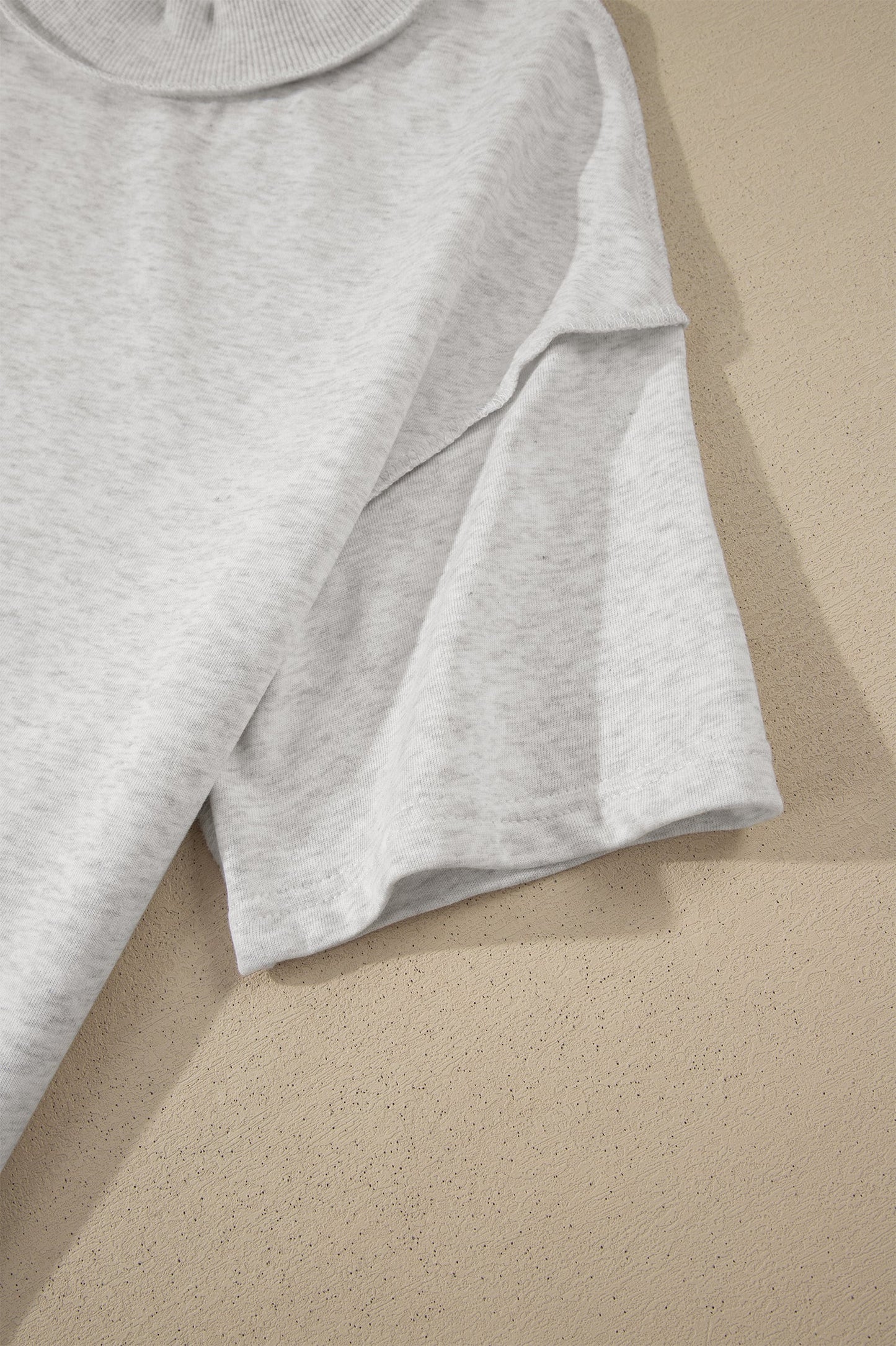 Solid Exposed Seam Mock Neck Tee