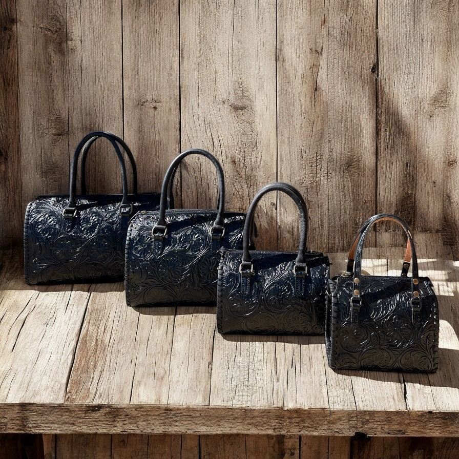 Black floral tooled leather speedy duffle bag