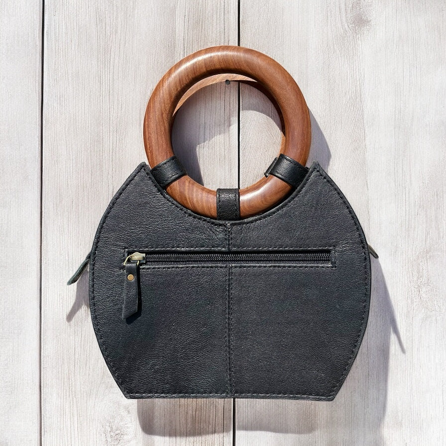 Black floral tooled leather handbag