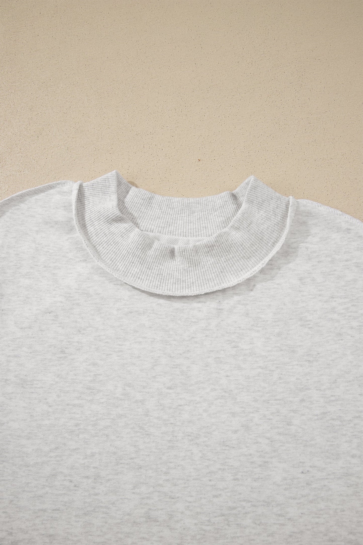 Solid Exposed Seam Mock Neck Tee