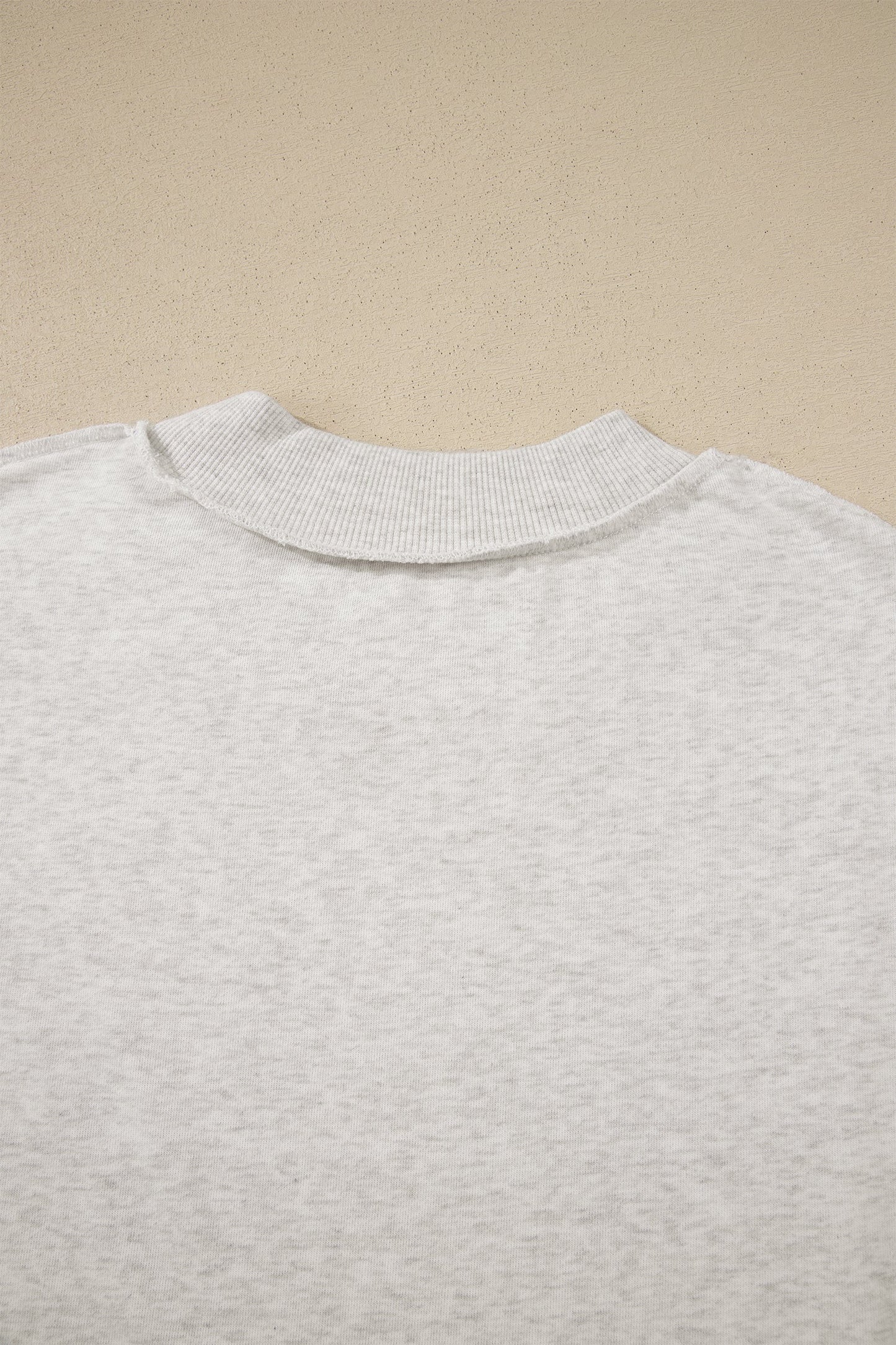 Solid Exposed Seam Mock Neck Tee