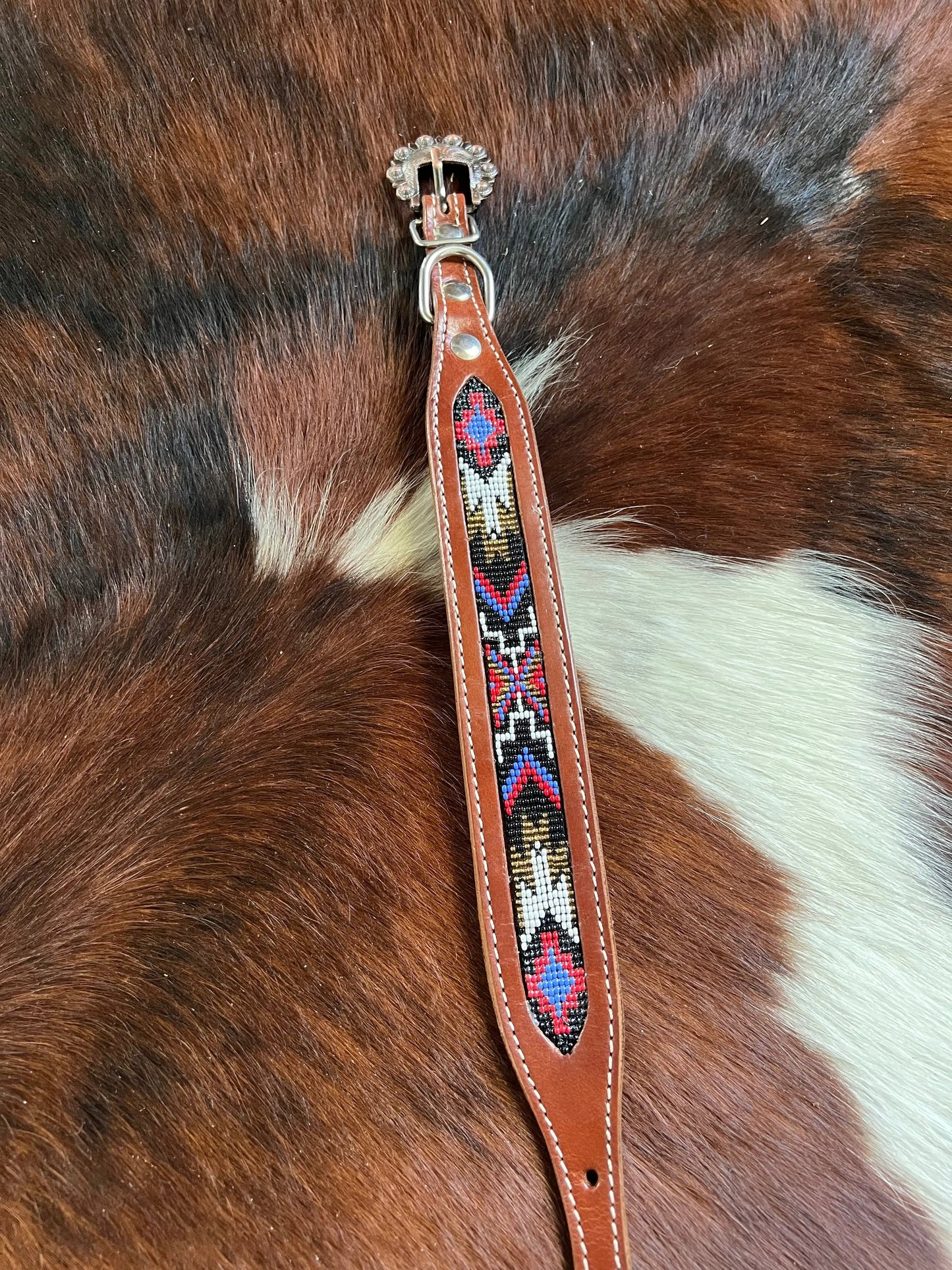 Genuine leather dog collar with red, black, periwinkle, white, and gold southwest beaded inlay design